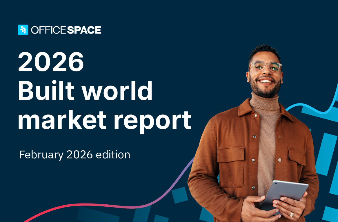 A man with glasses holds an iPad and smiles on the cover of OfficeSpace Software's 2026 Built World Market Report.