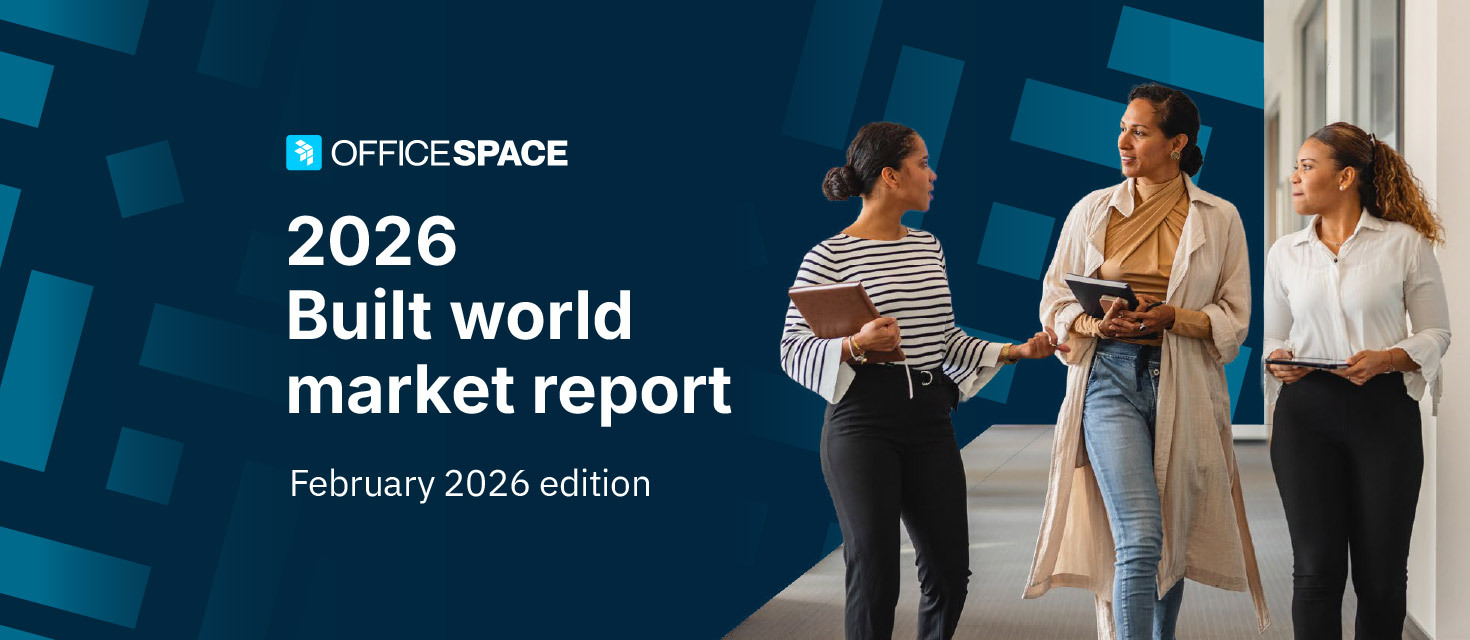 Business partners walking together discussing 2026 built world market report