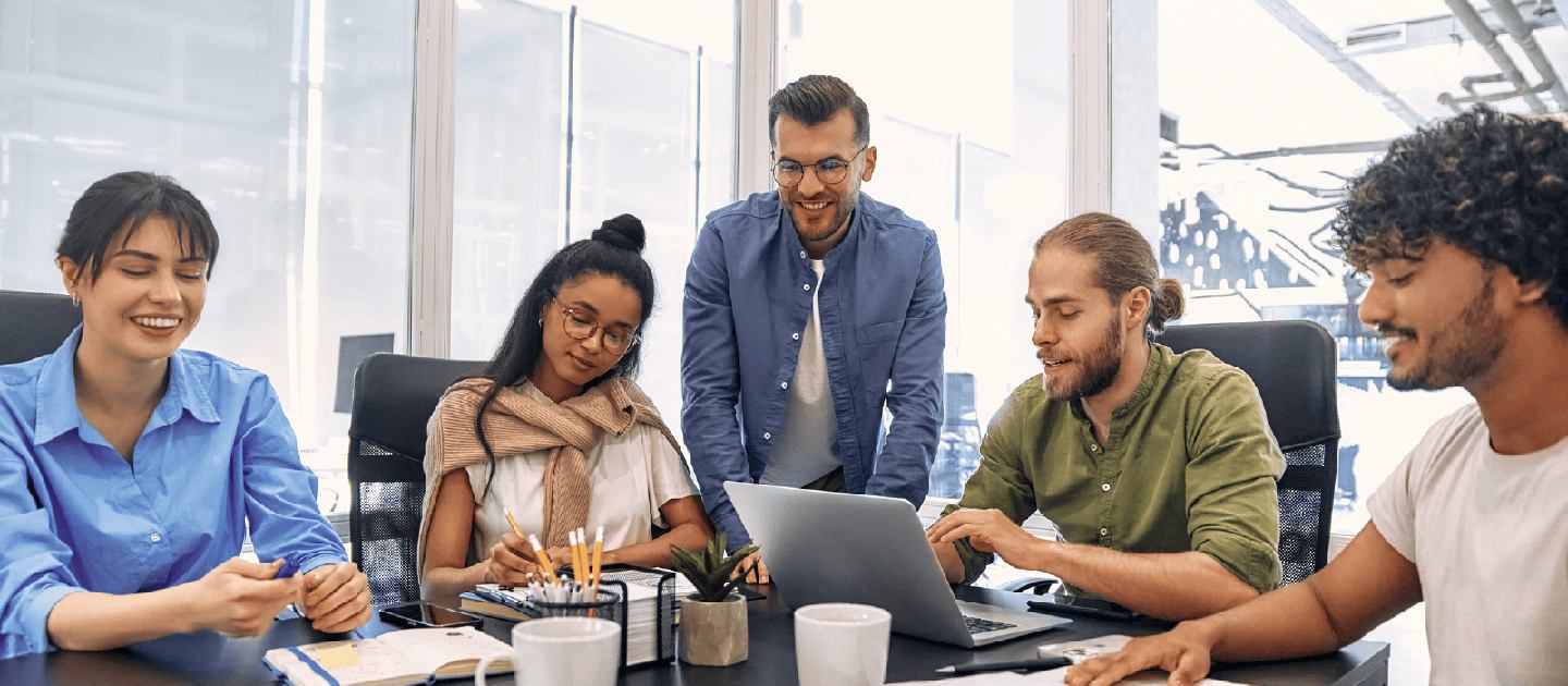 Solve the employee coordination tax. Young professionals enjoy collaboration in a meeting room.