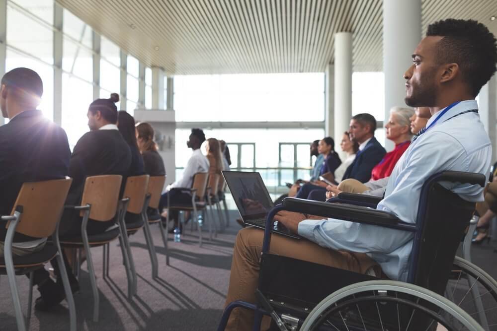 Audience at a conference event in office