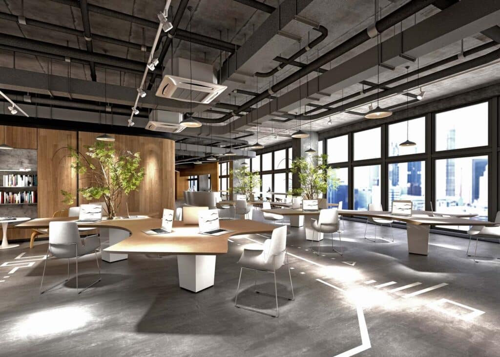 Modern open office with curved desks, computers, greenery, and large windows showcasing a cityscape.
