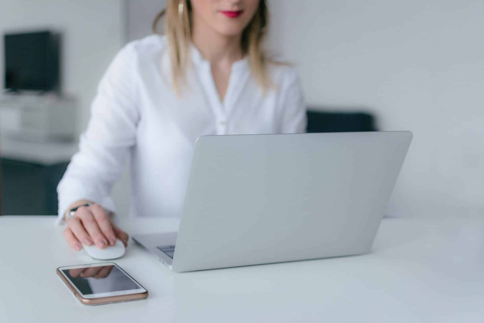 woman using a laptop at a desk