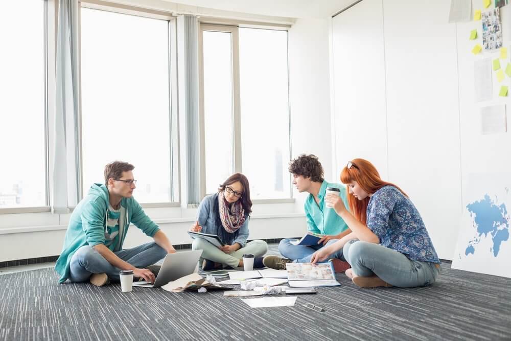 office employees sitting on the ground office employees sitting on the ground