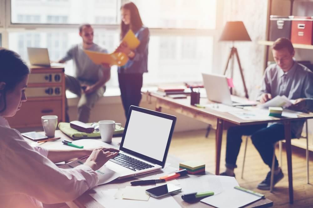 coworkers in a shared office space