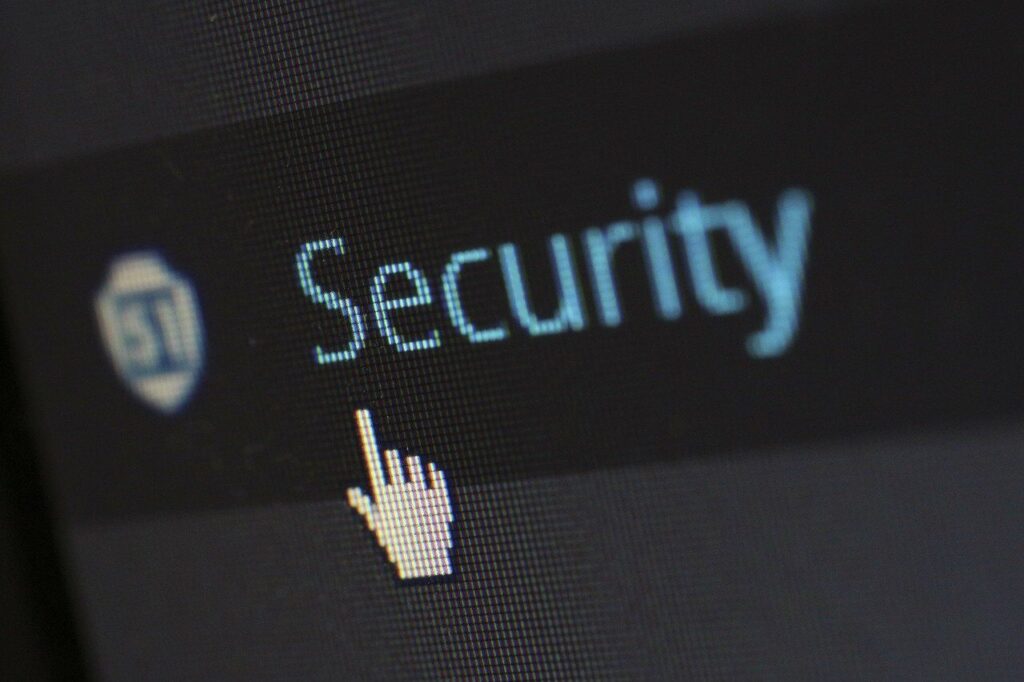 Close-up of a computer screen showing the word "Security" with a cursor pointing to it.