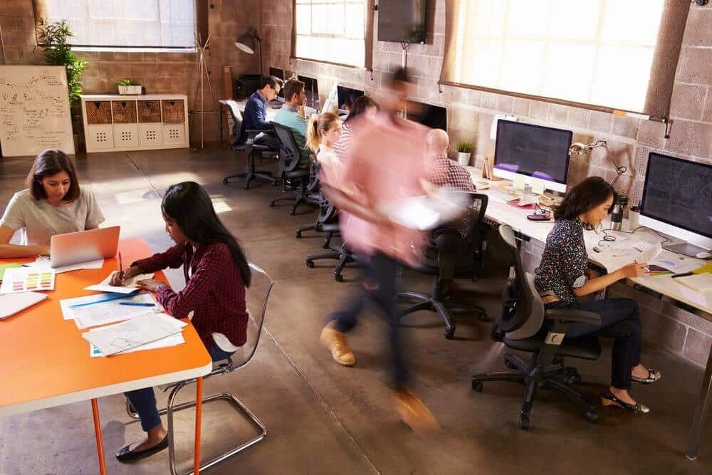 Workers In Busy Modern Design Office