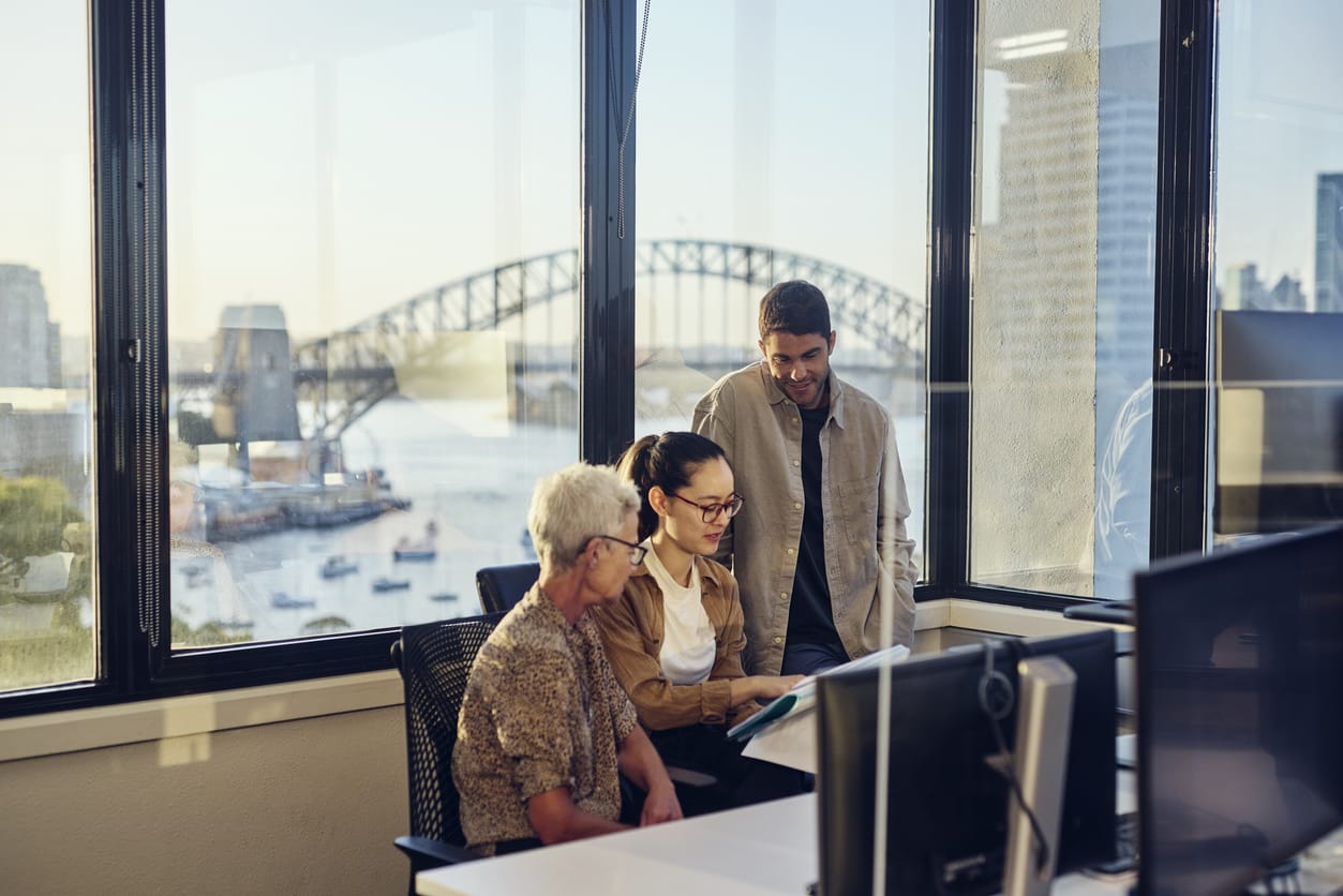 A diverse team of Australian professionals collaborating in a Sydney office.