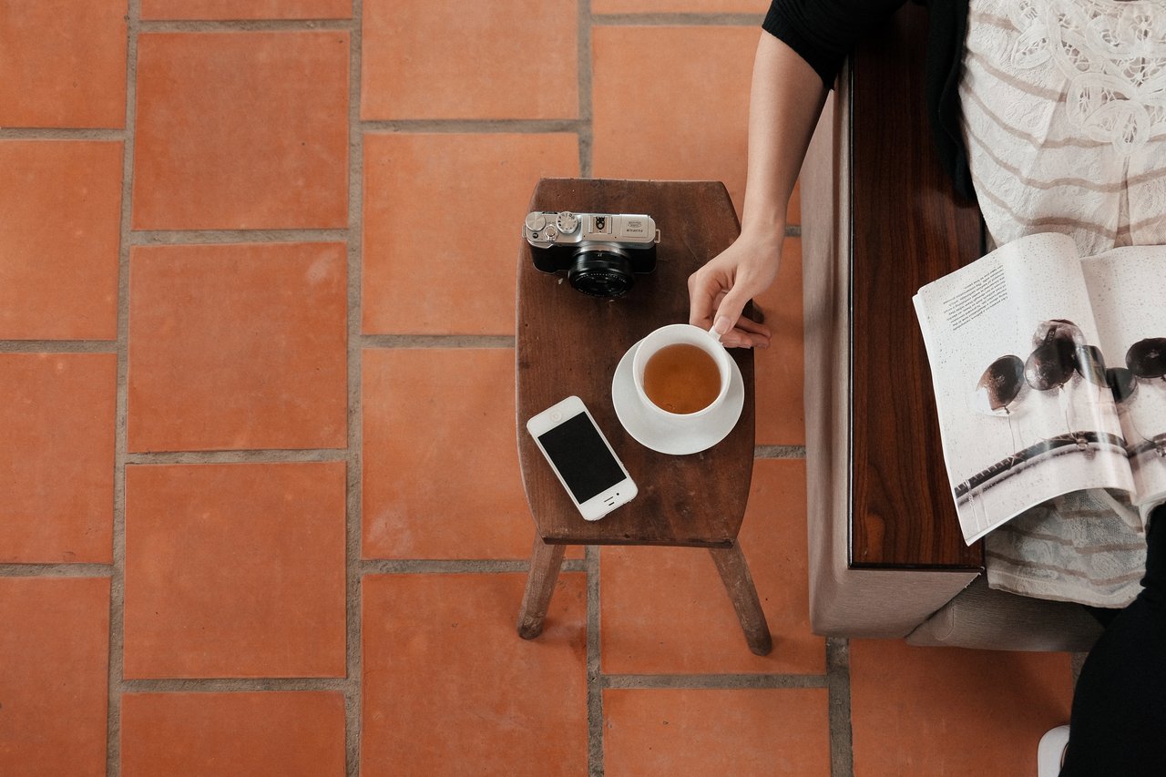 employee reading a magazine and having tea