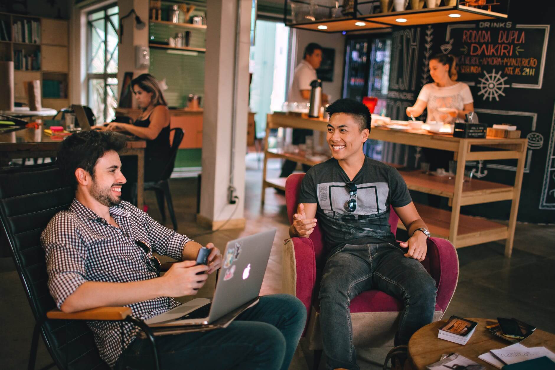 millennials talking in open layout flexible working office