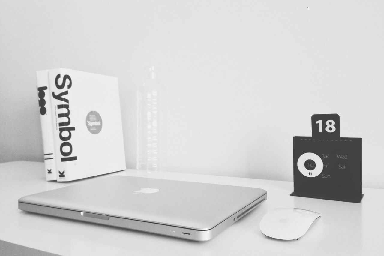 monochrome office laptop and desk