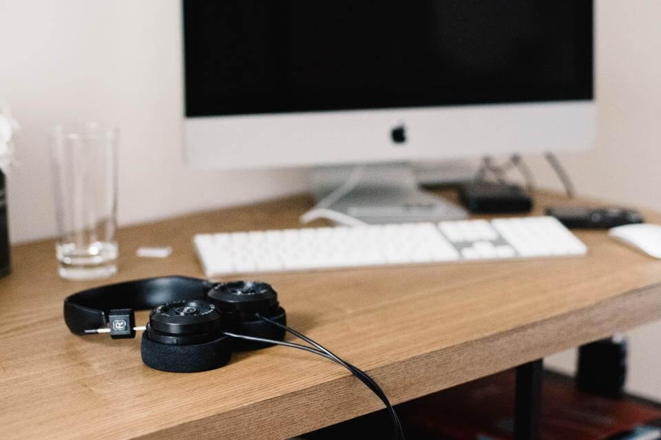 Noise Cancelling Headphones in Front of Desktop Noise Cancelling Headphones in Front of Desktop