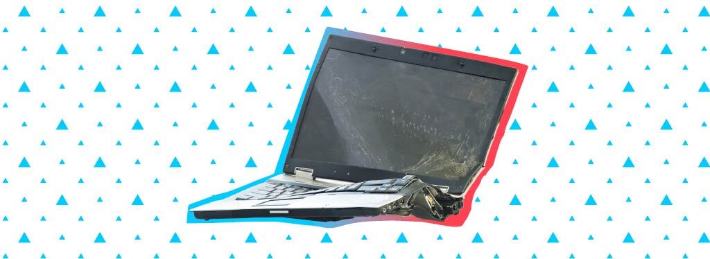 broken laptop surrounded by triangle pattern
