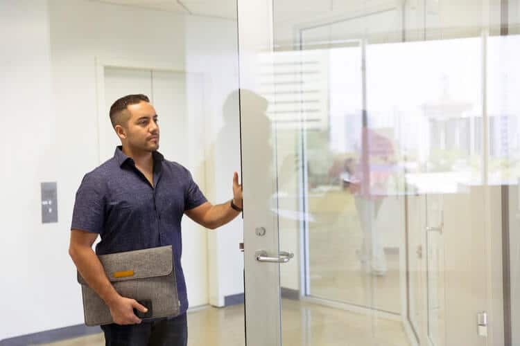 person going into HR meeting for employee performance review