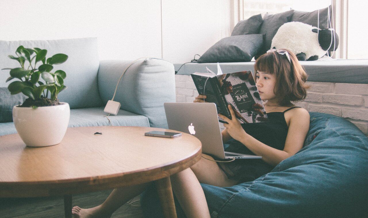 office employee reading in a break area