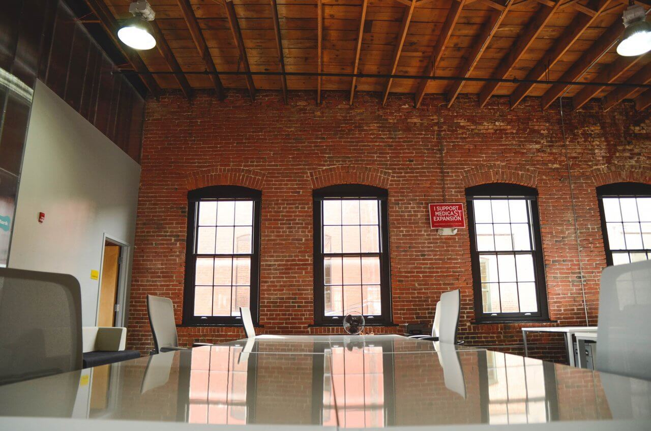 large open office with long table large open office with long table