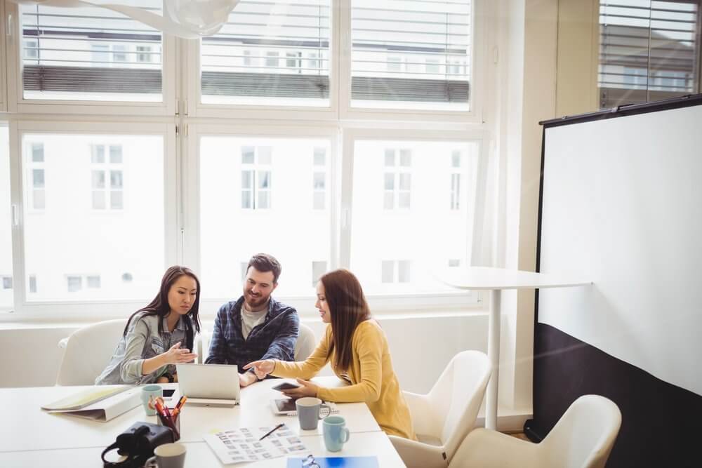 group of office employees in a meeting