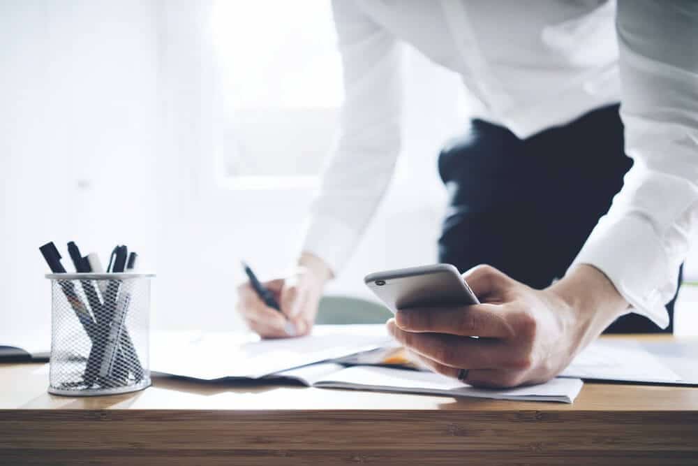 Businessman using smartphone and working