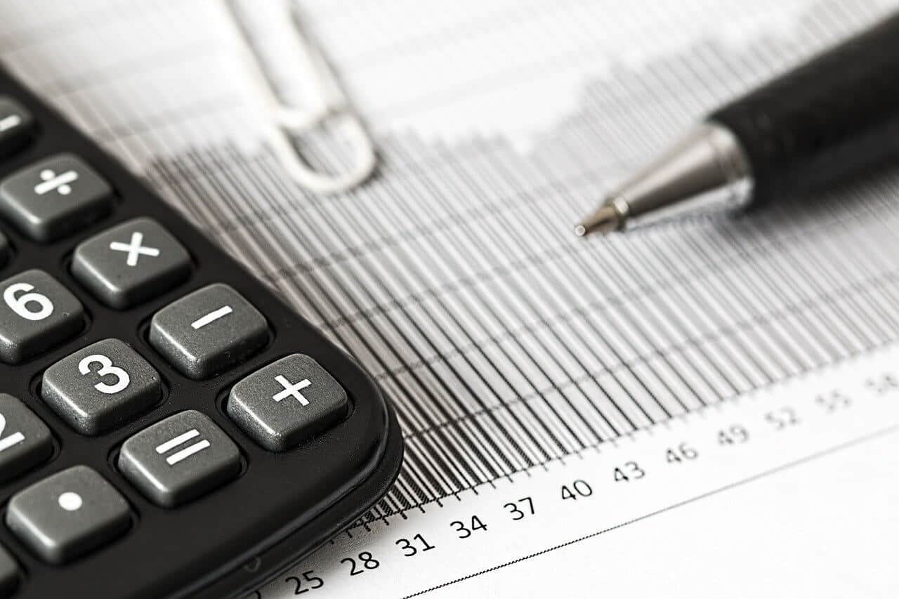 calculator, pen and reports calculator, pen and reports